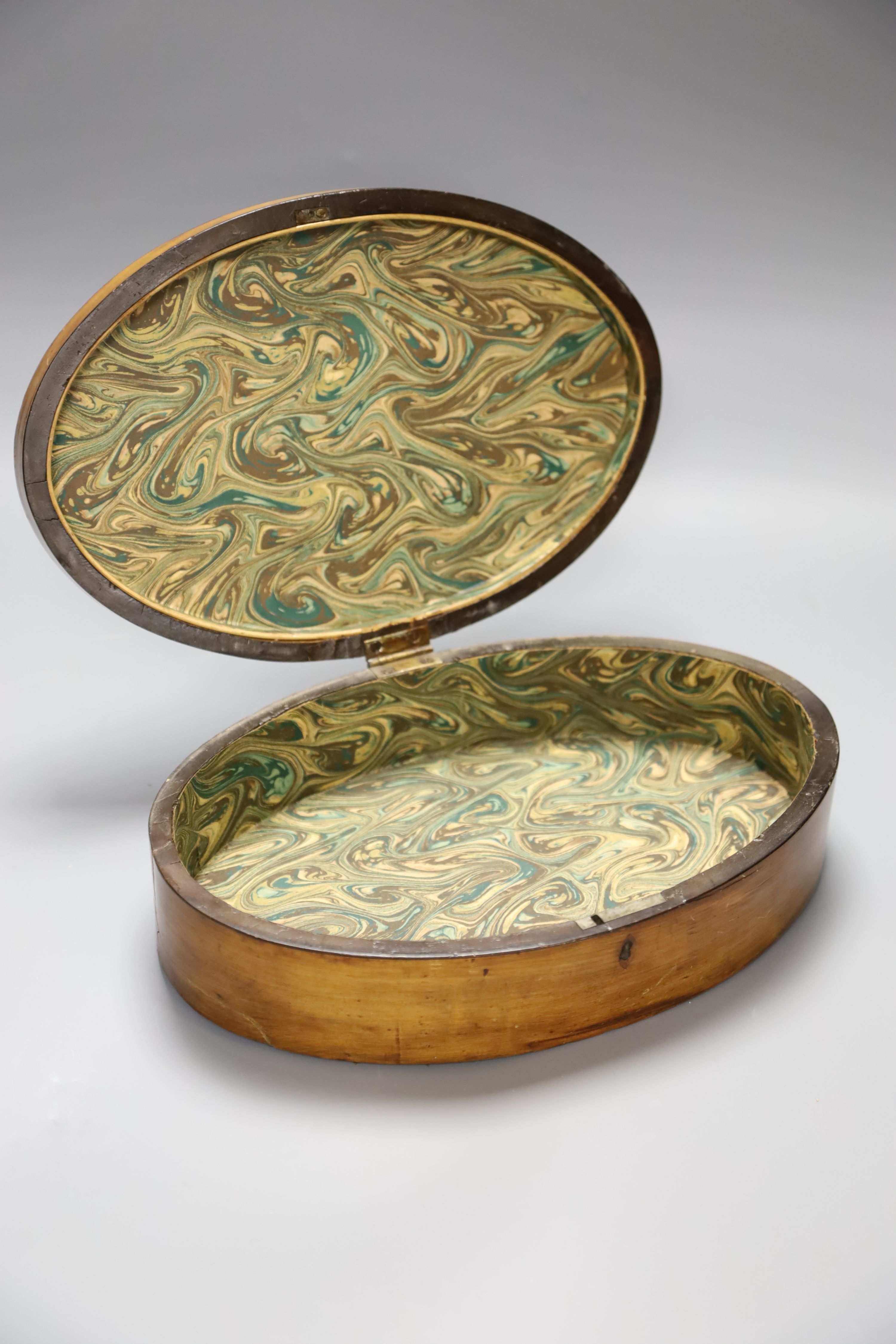 A George III oval marquetry inlaid box, length 29cm